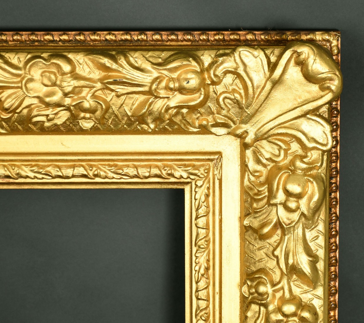 A 20th Century gilt composition frame, rebate size 30" x 40" (76cm x 101.5cm).