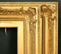 A pair of 19th Century gilt composition swept frames, rebate size each 10" x 20", 25.5cm x 51cm.