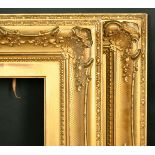 A pair of 19th Century gilt composition swept frames, rebate size each 10" x 20", 25.5cm x 51cm.