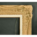 A carved swept frame, rebate size without slip, 24" x 32", (61 x 81.5 cm) with slip 22" x 30.5", (56