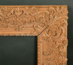 A highly carved 20th Century frame, rebate size 20" x 24".