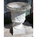 A Pair of carved white marble urns on Stands, Height of Urns 40.5", Height of stands 31.5".