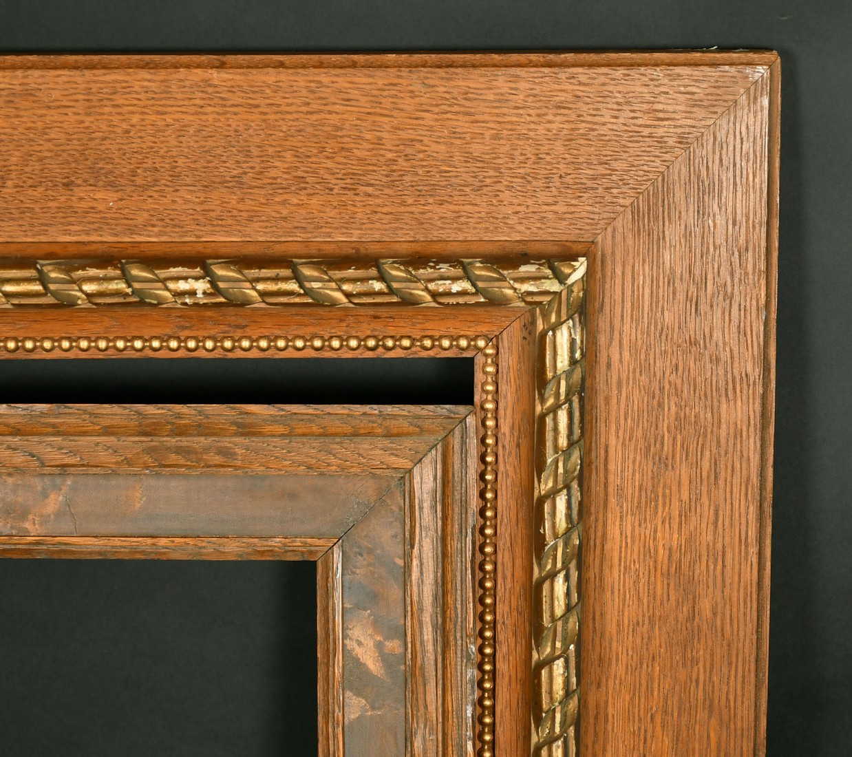 A moulded Oak frame with burr wood inset, 12" x 30" along with an Oak frame with gilded