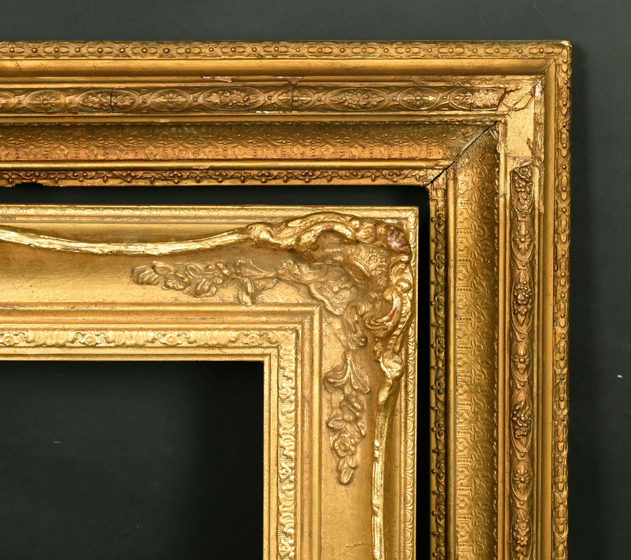 A 19th Century gilt composition frame, 20.5" x 16.5" and a later composition swept frame, 14" x