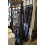 A pair of folding louvre shutter screens.