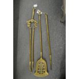 A brass companion set.