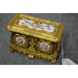 A small ormolu casket mounted with porcelain panels (AF).