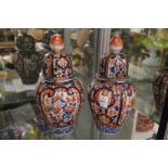 A pair of Imari jars and covers.