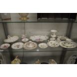 A shelf of decorative china to include a Limoges dish etc.