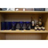 Bristol Blue goblets and other decorative blue glassware.