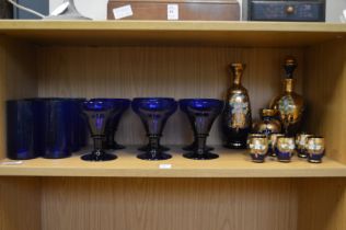 Bristol Blue goblets and other decorative blue glassware.