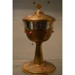 A silver gilt chalice and cover.