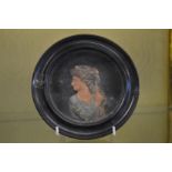 A moulded wax portrait miniature.