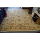 An Indian carpet, beige ground with stylized floral decoration 10ft 2ins x 8ft.