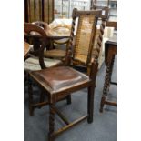 A set of four oak dining chairs.