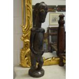 A large African carved wood standing male nude.