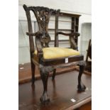 A miniature Chippendale style carved mahogany armchair.