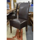 A set of six brown leather upholstered highback modern dining chairs.