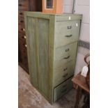 An old four drawer filing cabinet, later painted.