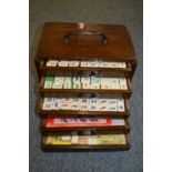 A Chinese Mahjong set in a carved hardwood box.