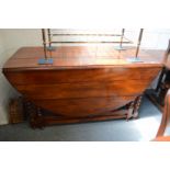 A good large hardwood oval drop-leaf double gate-leg dining table.