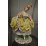 A Capodimonte style porcelain figurine of a lady.