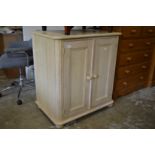 A painted pine two door cupboard.