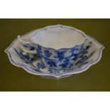 A Meissen blue and white small cup and saucer.