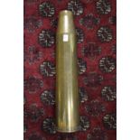 A large brass shell case, 23ins high.