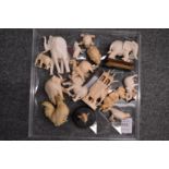 A collection of Japanese ivory small okimonos of elephants and other animals and birds.