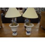 A pair of decorative urn shaped table lamps.