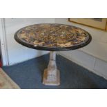 An Italian Renaissance revival inlaid marble circular table on a carved dolphin form support (AF).