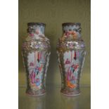 A pair of Canton vases with moulded decoration.