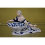 A Meissen blue and white porcelain figural dish.