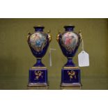 A pair of small Vienna porcelain pedestal vases.