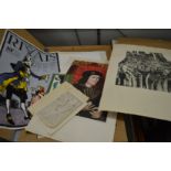 A folder of unframed artwork.