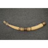 A carved ivory and silver plate mounted horn shaped vessel.