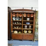 A mahogany cupboard bookcase.