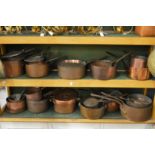A good large collection of 19th century copper cooking pans and similar vessels.
