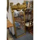 An unusual carved and gilded dressing mirror.