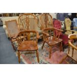 A pair of Victorian style ash, beech and elm broad arm high-back Windsor armchairs.