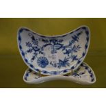 A pair of Meissen blue and white crescent shaped dishes.