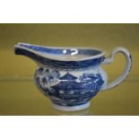 A blue and white jug.