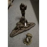 Three bronze resin erotic figure groups.