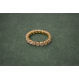 An 18ct gold and diamond eternity ring.