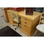 A good modern light oak twin pedestal desk with office swivel chair.