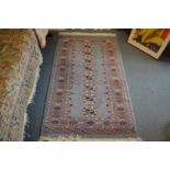 A pale blue ground Bokhara style rug.