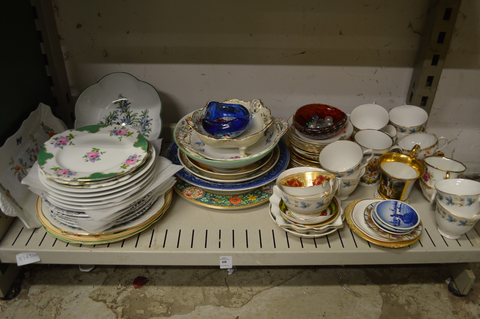 A shelf of decorative china.