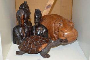 Carved African figures to include a hippo.