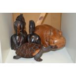 Carved African figures to include a hippo.